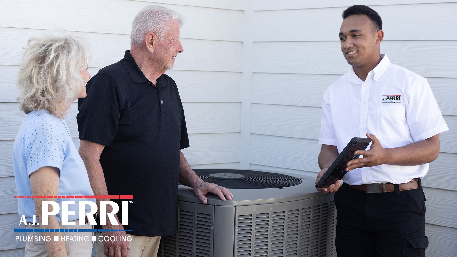 A.J. Perri technician speaking to a couple about their HVAC in Long Branch, NJ.