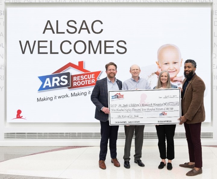 CHRO Chris Snow and CFO Christie Grumbos presenting our 2024 donation to representatives from St. Jude