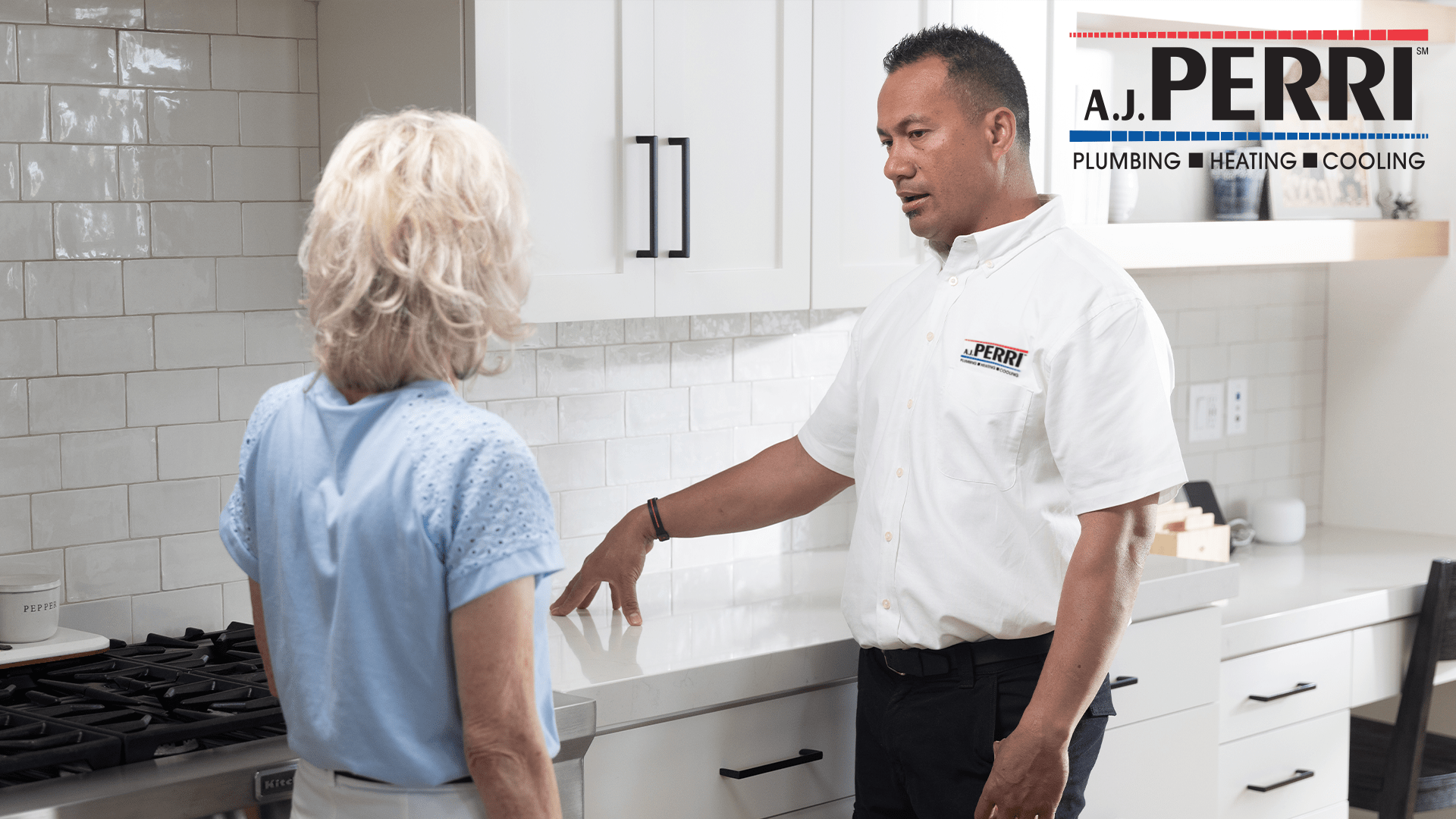 HVAC tech speaking with woman about her home's plumbing in New Jersey.